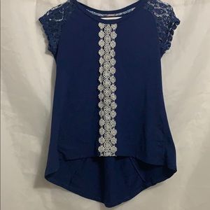 A blue shirt with cute designs on the front